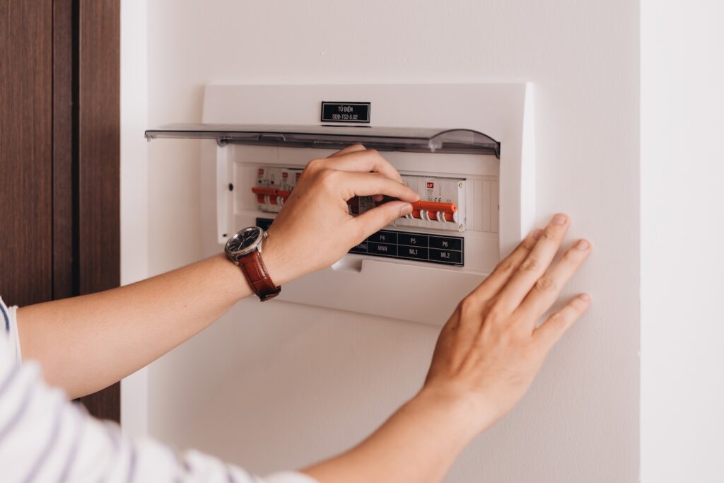 homeowner using electrical panel