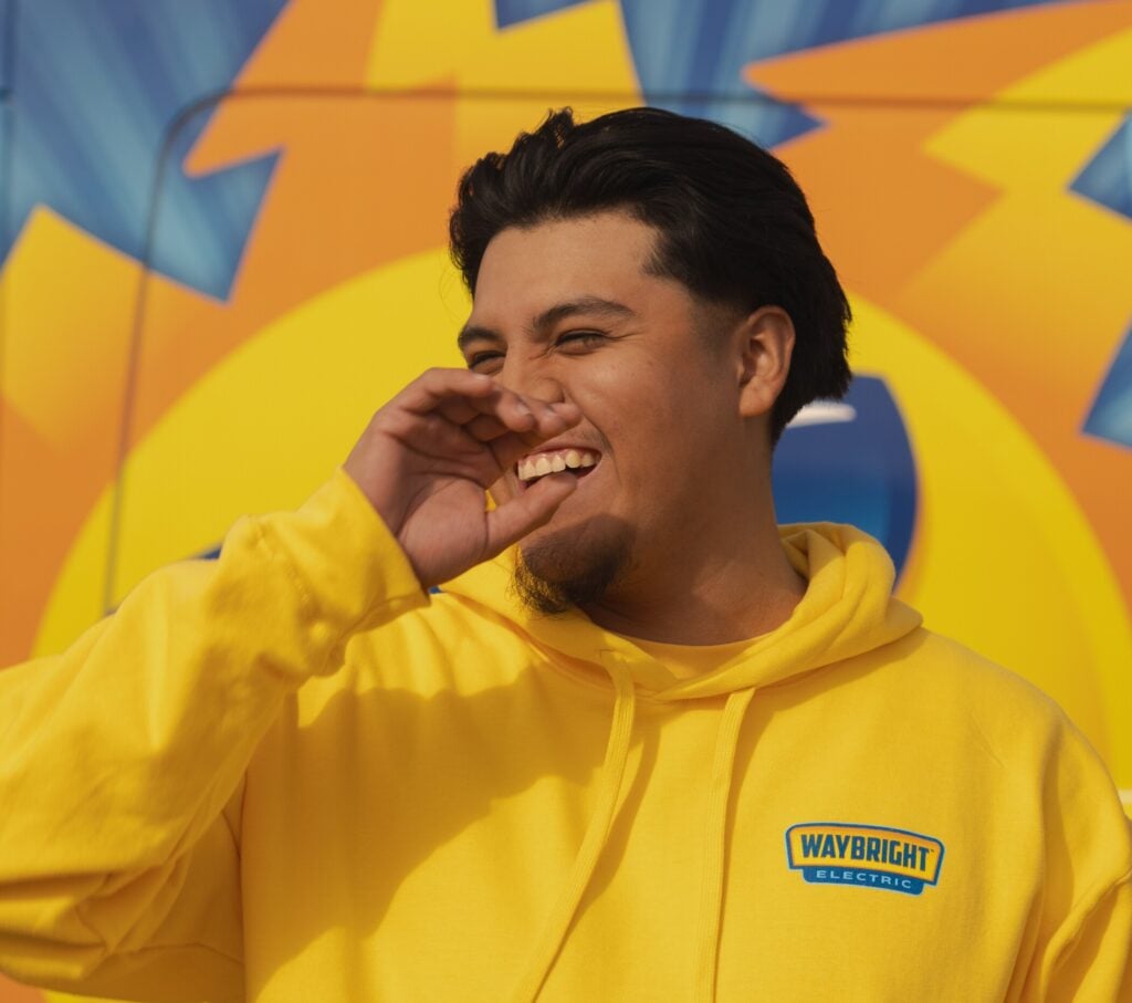 Waybright team member in front of their truck