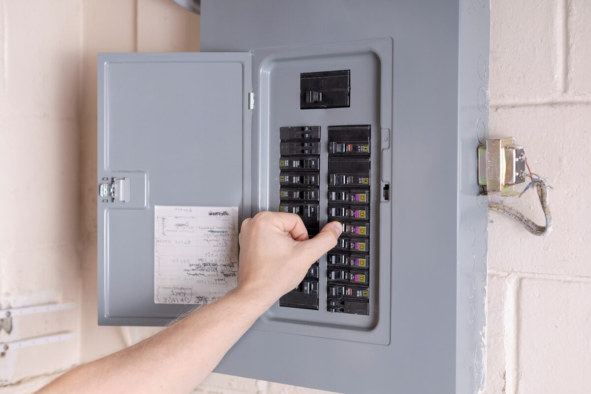 Person using electrical control panel