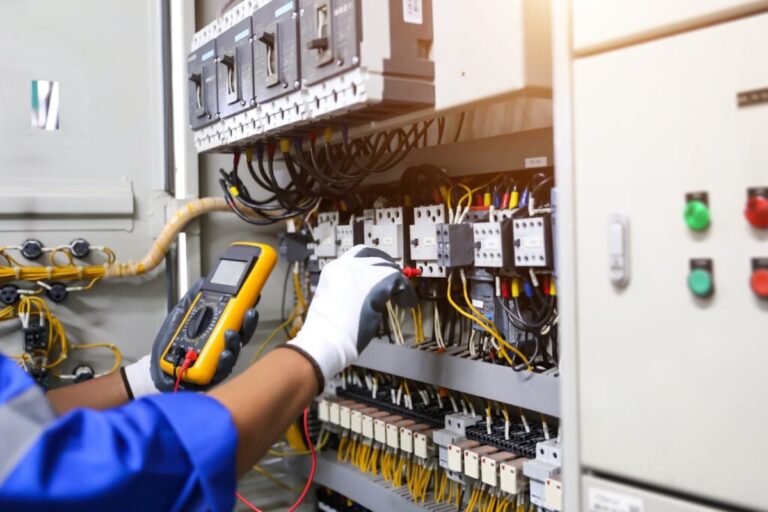 Electrical service technician holding electricity checking equipment