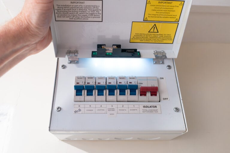 Close-up of a modern, domestic fuse and circuit breaker cabinet in a typical household.