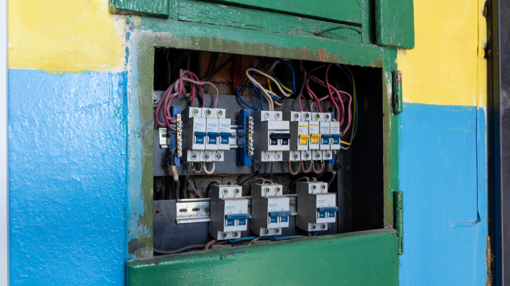 Electrical distribution board with fuses or circuit breakers in an old apartment building. Electrical equipment.