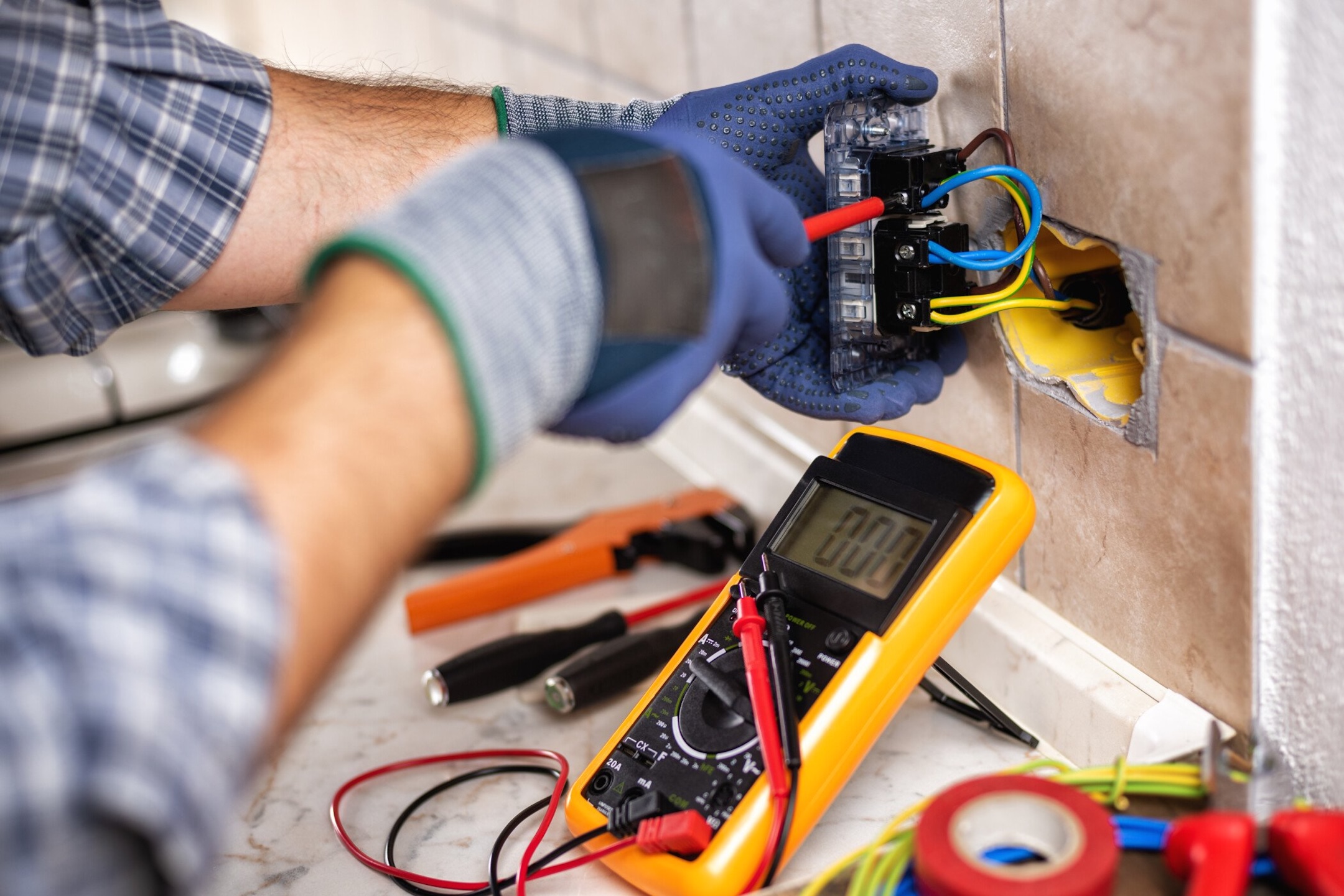 Electrician-at-work-with-safety-equipment-on-a-residential-electrical-system