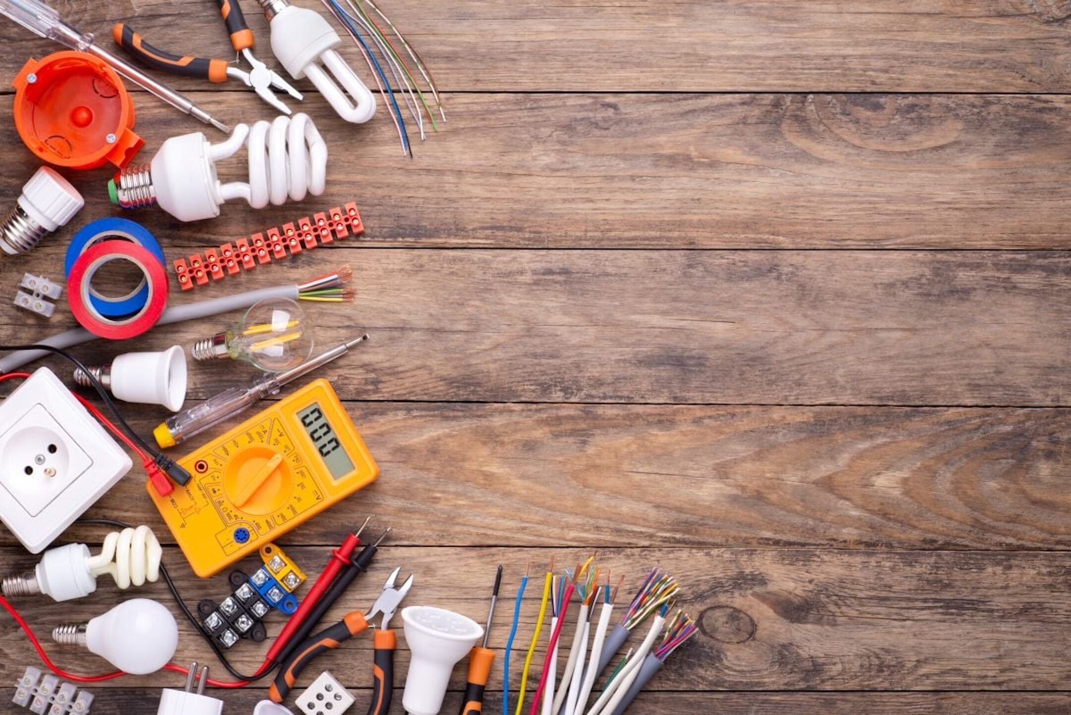 Electrician-equipment-on-wooden-background