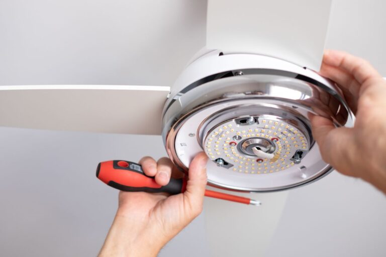 electrician installing ceiling fan