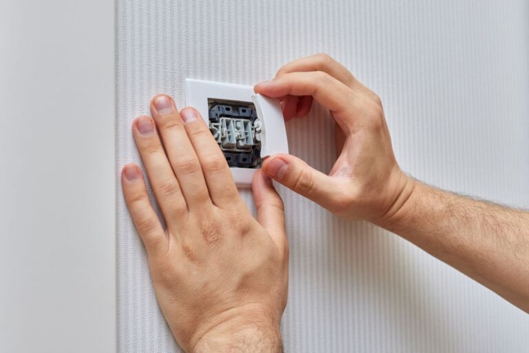 worker installing new switches
