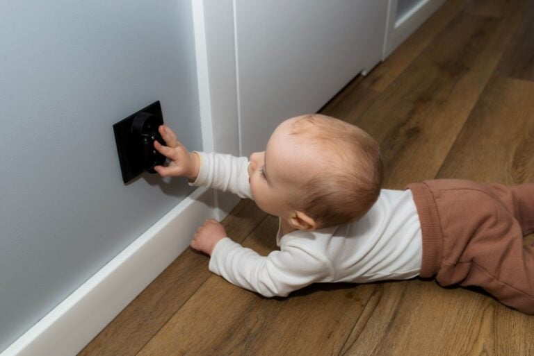 outlet covers baby touching black electrical inside house
