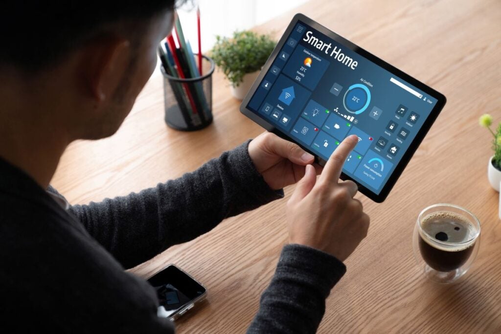 smart electrical panel man changin electricity setting on ipad