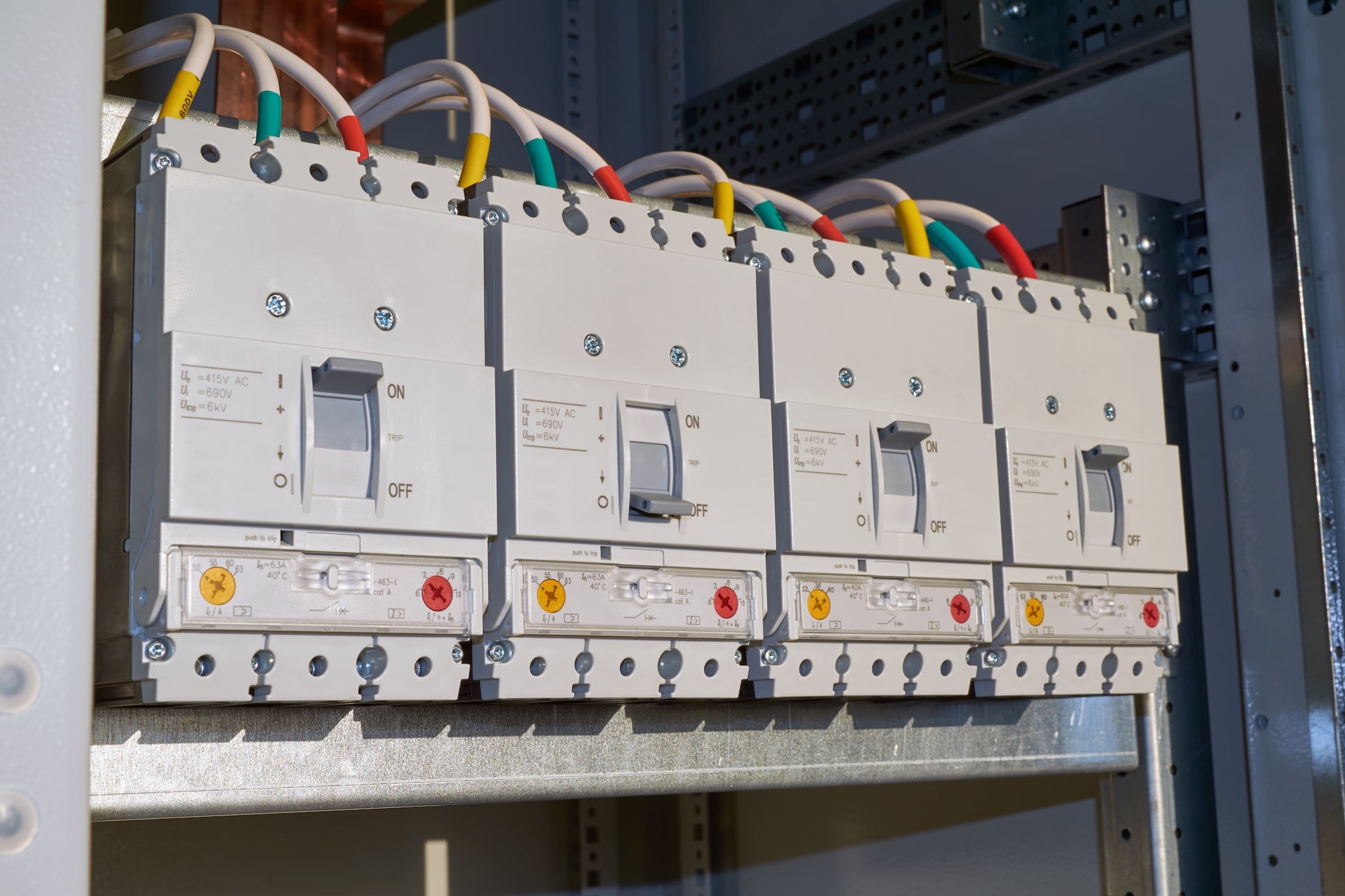 Four power circuit breakers are fixed in the electrical Cabinet in line.